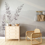 A serene minimalist wallpaper featuring delicate grass silhouettes against a soft, misty mountain backdrop in muted gray tones.