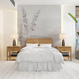 A serene minimalist wallpaper featuring delicate grass silhouettes against a soft, misty mountain backdrop in muted gray tones.