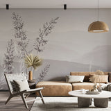 A serene minimalist wallpaper featuring delicate grass silhouettes against a soft, misty mountain backdrop in muted gray tones.