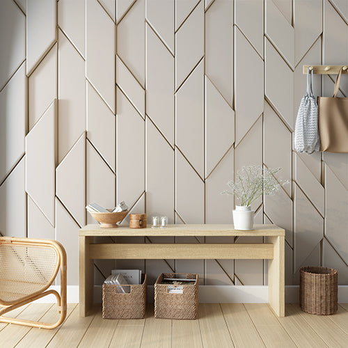 A minimalist geometric wallpaper featuring a repeating pattern of overlapping diamond shapes in a neutral beige tone.