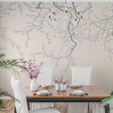 A serene wallpaper design featuring delicate cherry blossom branches in soft gray and white tones against a muted background.
