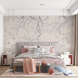 A serene wallpaper design featuring delicate cherry blossom branches in soft gray and white tones against a muted background.