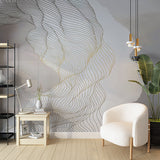 A minimalist abstract wallpaper with flowing lines in shades of gray and gold, creating a sense of movement and fluidity.