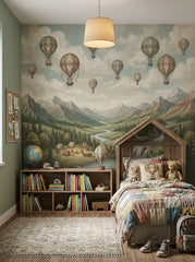 Vintage hot air balloon wallpaper mural with mountain landscape, river, waterfalls, pine forest, camping tents and cloudy sky.
