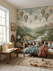Hot air balloon mountain wallpaper displayed in a cozy children’s bedroom with wooden bed, bookshelves and adventure decor.