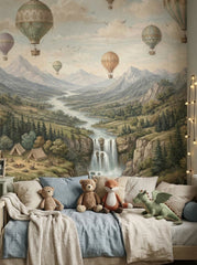 Hot air balloon mountain wallpaper displayed behind a cozy kids bed with plush toys and vintage adventure decor.