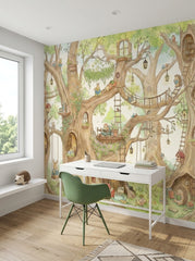 Treehouse nursery wallpaper with woodland animals, reading spaces and giant illustrated trees behind a modern kids study desk.