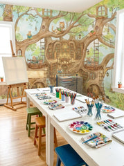 Storybook woodland wallpaper with giant tree library, reading animals and balconies in a bright kids art room.