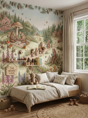 Storybook woodland wallpaper with bears, pine forest, log cabins, wildflowers and soft sage green neutral colors.