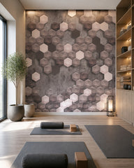 Pink and grey 3D hexagon wallpaper in a fitness studio.