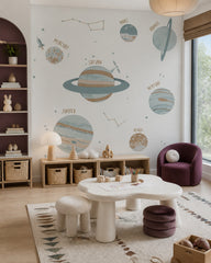 Solar system wallpaper in a children’s playroom.