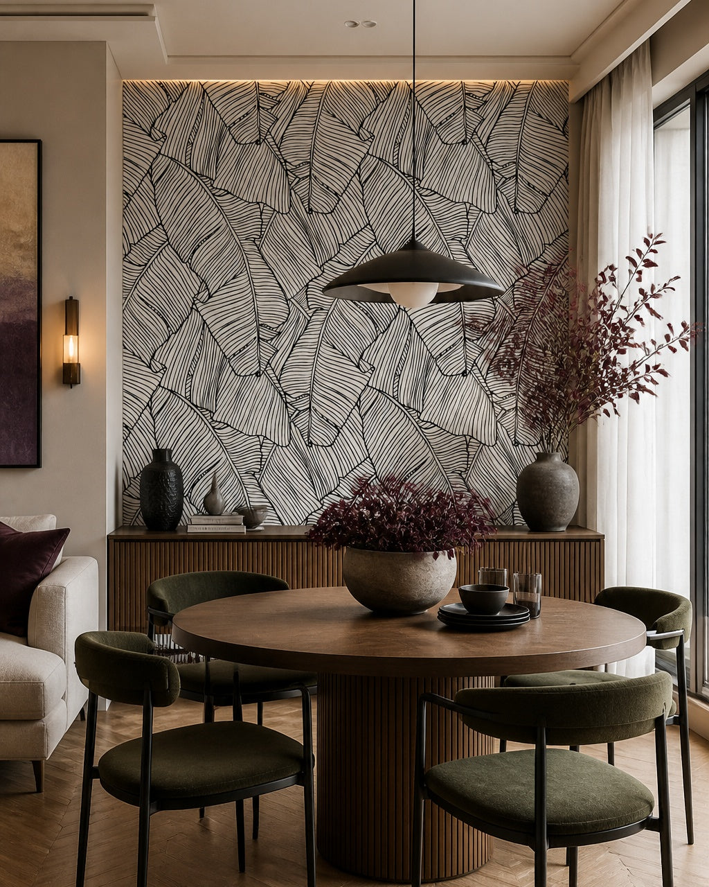 Black and white banana leaves wallpaper in a refined dining area.