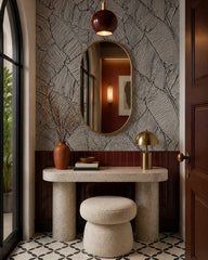 Black and white banana leaves wallpaper in a refined foyer.