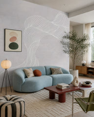 Abstract woman with flowing hair line art wall mural in a designer living room.
