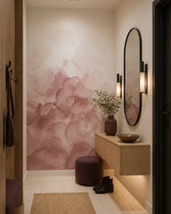 Blush pink abstract watercolor wall mural in an architectural hallway.