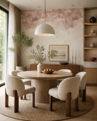 Blush blossom wallpaper in a refined dining area.