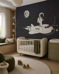 Astronaut riding a space shuttle kids’ wall mural in a modern nursery with a crib.