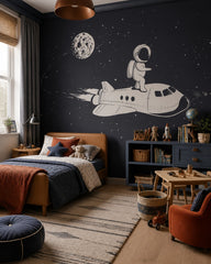 Astronaut riding a space shuttle kids’ wall mural in a toddler bedroom with a child-sized bed.