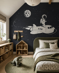Astronaut riding a space shuttle kids’ wall mural in a girl’s bedroom.