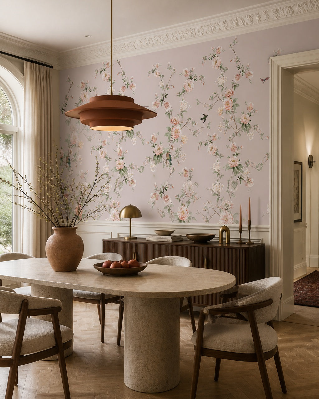 Peach blossoms and birds wallpaper in a refined dining area.