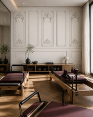 White baroque panel wallpaper in a fitness studio.