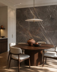 Dark grey marble wallpaper in a refined dining area.