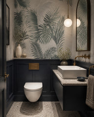 Soft green palm leaves wallpaper in an elegant powder room.