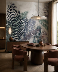 Watercolor palm fronds wallpaper in a refined dining area.
