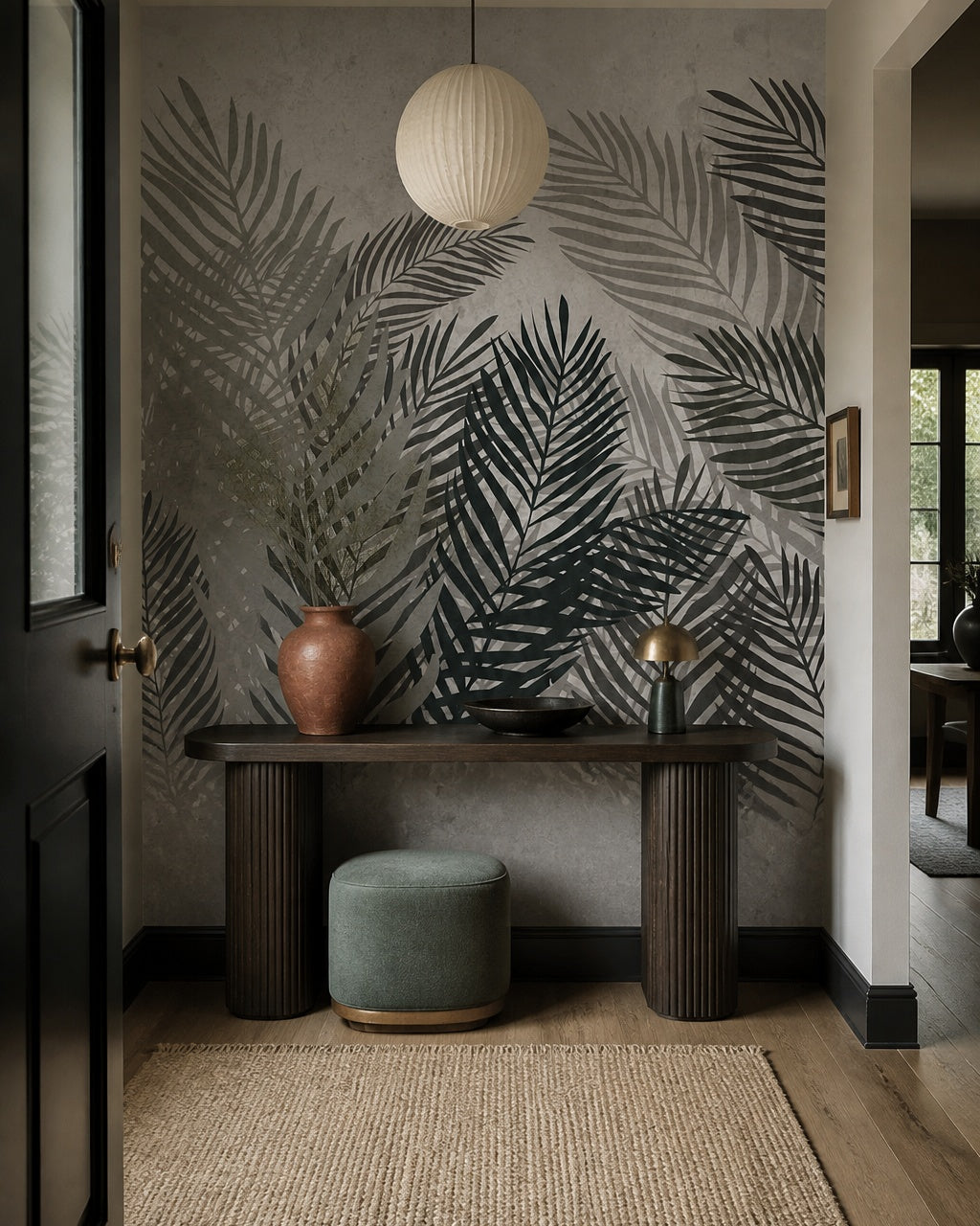 Monochrome palm fronds wallpaper in a refined foyer.