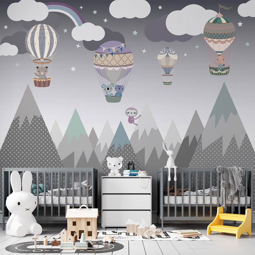 Kids room wallpaper with storybook animals in ornate hot-air balloons above patterned mountains, clouds, stars, a rainbow, and a sloth.