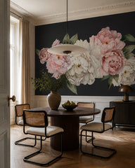 Peony flowers on black wallpaper in a refined dining area.