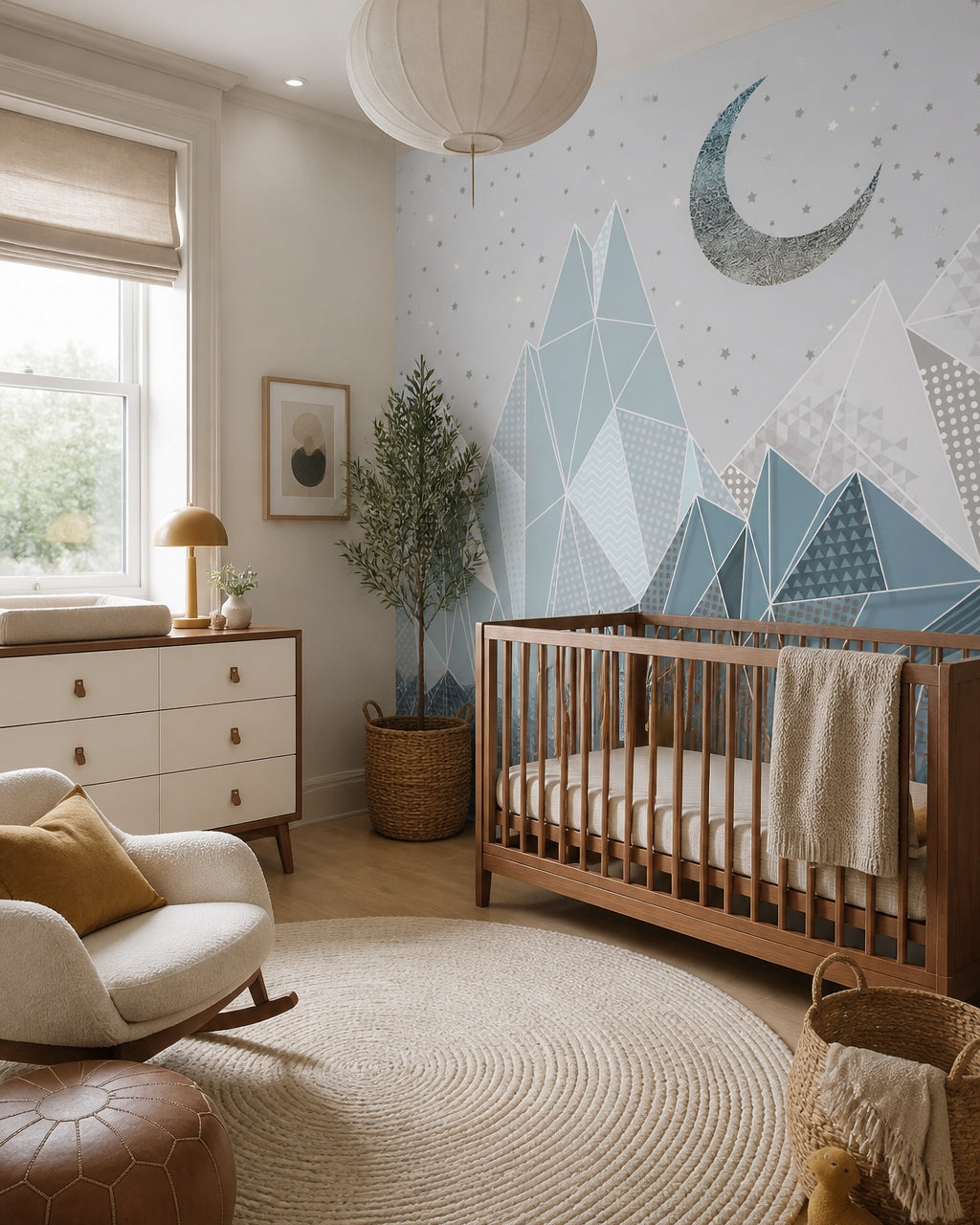 Geometric mountains under the moon kids room wallpaper in a modern nursery with a crib.