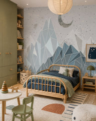 Geometric mountains under the moon kids room wallpaper in a toddler bedroom with a child-sized bed.