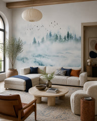 Misty mountain forest wallpaper in a designer living room.