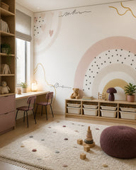 Boho rainbow wallpaper in a children’s playroom.
