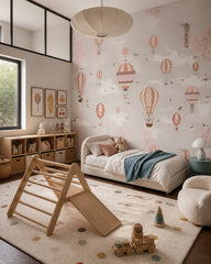 Terracotta hot air balloons wallpaper in a toddler bedroom with a child-sized bed.