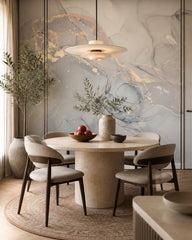 Sage and gold marble wallpaper in a refined dining area.