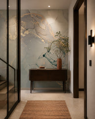 Sage and gold marble wallpaper in an architectural hallway.