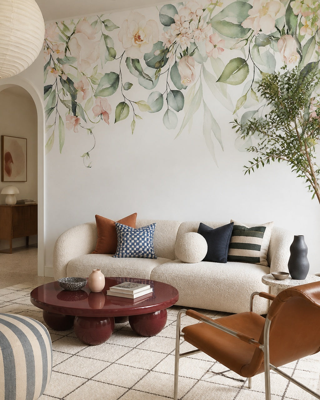 Watercolor floral garland wallpaper in a designer living room.