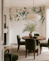 Watercolor floral garland wallpaper in a refined dining area.