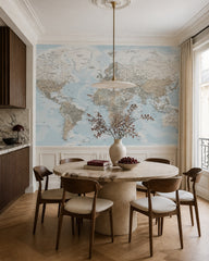 Pastel physical world map wallpaper in a refined dining area.