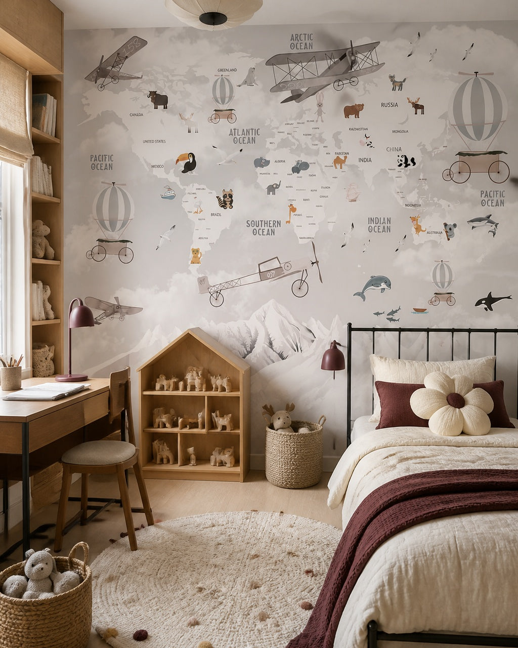 Vintage aviation & wildlife world map wall mural in a girl’s bedroom.