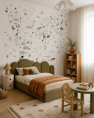 Hand-drawn animals of the world map wall mural in a toddler bedroom with a child-sized bed.