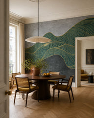 Gold line art wallpaper in a refined dining area.