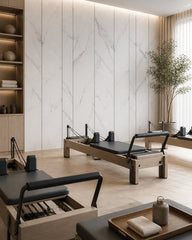 White marble panels with black lines wall mural in a fitness studio.