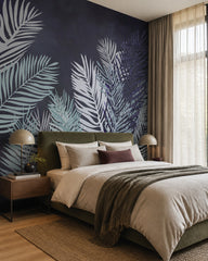 Dark navy palm leaves wallpaper in a designer bedroom.