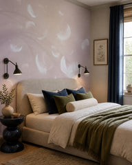 White feathers on lilac wallpaper in a designer bedroom.