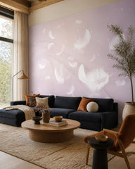 White feathers on lilac wallpaper in a designer living room.