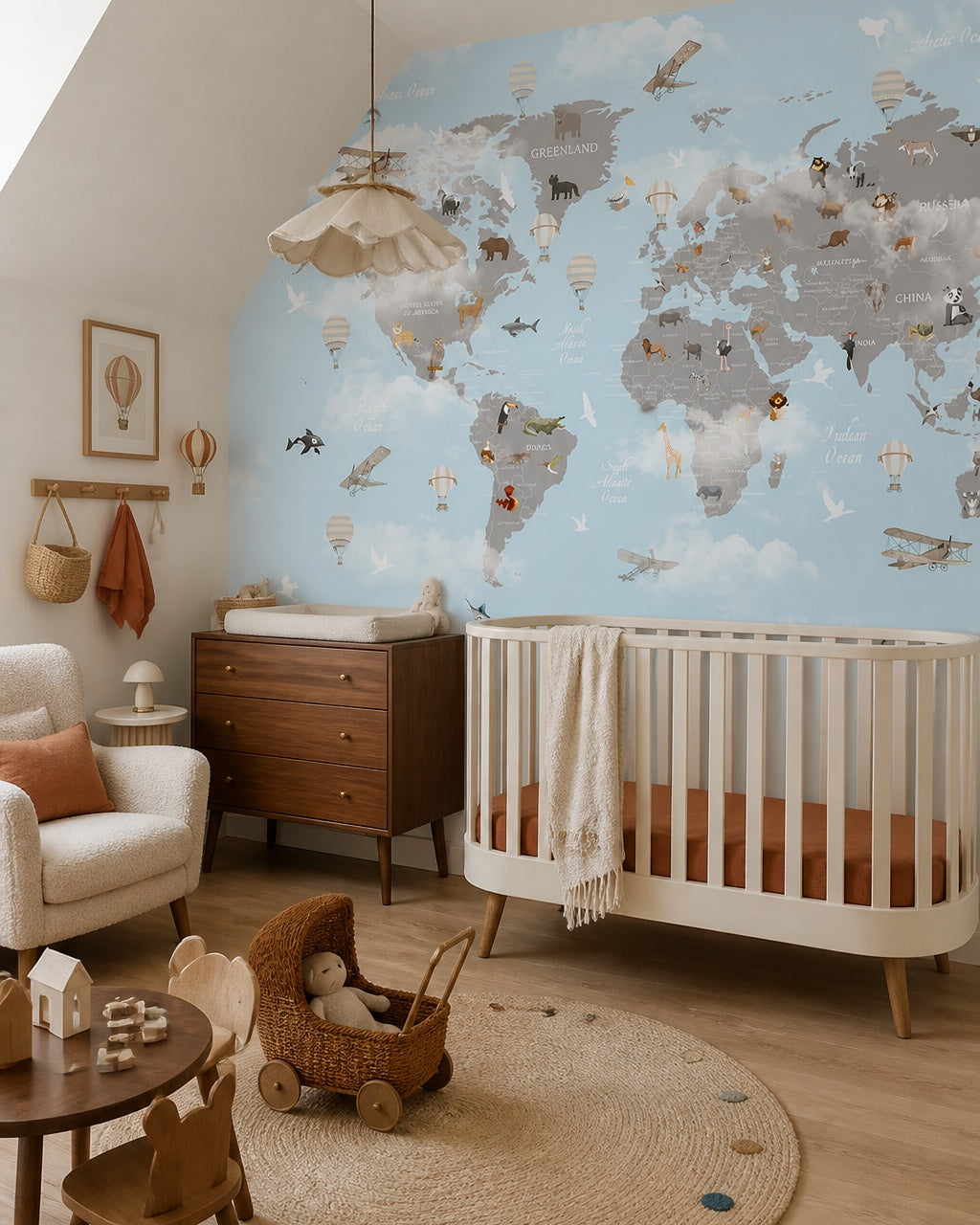 Watercolor wildlife world map & hot air balloons mural in a modern nursery with a crib.