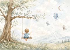 Adventure nursery wallpaper featuring a boy on a swing beneath a large tree with blue balloons and soft watercolor mountains.